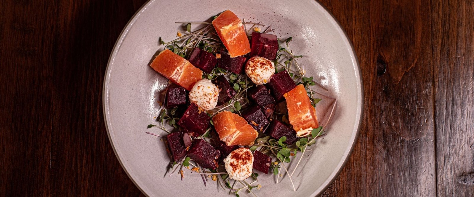 Orange & Beet Salad featuring Red Beets, Goat Cheese, Local Micro Greens, Citrus Peel Maldon, Raspberry Vinaigrette (Gluten Free and Vegetarian) at Red Cork Bistro in Mukilteo Orange & Beet Salad featuring Red Beets, Goat Cheese, Local Micro Greens, Citrus Peel Maldon, Raspberry Vinaigrette (Gluten Free and Vegetarian) at Red Cork Bistro in Mukilteo