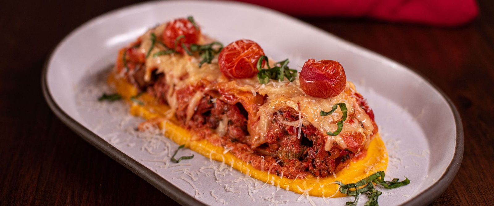 Wild Boar Cannelloni with Wild Boar Bolognese, Marinara Cream Sauce, Melted Cheese, and Carrot Purée at Red Cork Bistro in Mukilteo Wild Boar Cannelloni with Wild Boar Bolognese, Marinara Cream Sauce, Melted Cheese, and Carrot Purée at Red Cork Bistro in Mukilteo
