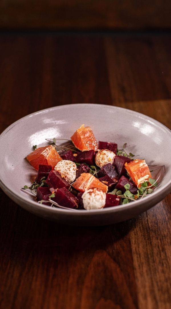 Orange & Beet Salad featuring Red Beets, Goat Cheese, Local Micro Greens, Citrus Peel Maldon, Raspberry Vinaigrette (Gluten Free and Vegetarian) at Red Cork Bistro in Mukilteo Orange & Beet Salad featuring Red Beets, Goat Cheese, Local Micro Greens, Citrus Peel Maldon, Raspberry Vinaigrette (Gluten Free and Vegetarian) at Red Cork Bistro in Mukilteo