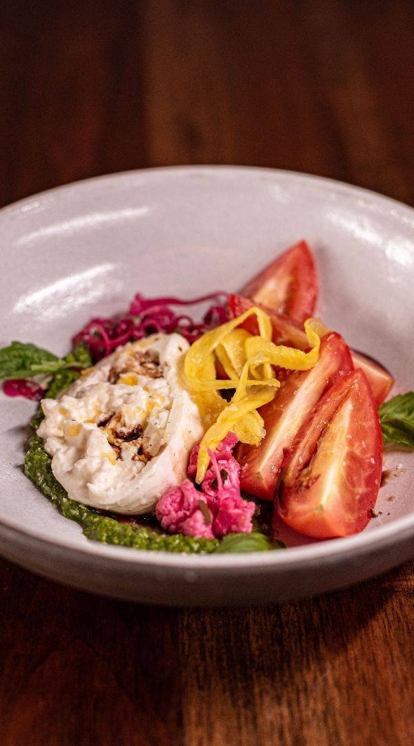 Caprese Salad with Burrata, Roma Tomato, Pistachio Pesto, Pickled Vegetables (Gluten Free and Vegetarian) at Red Cork Bistro in Mukilteo Caprese Salad with Burrata, Roma Tomato, Pistachio Pesto, Pickled Vegetables (Gluten Free and Vegetarian) at Red Cork Bistro in Mukilteo