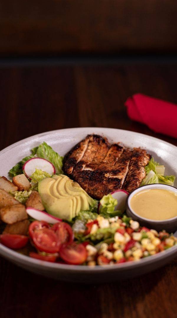 Blackened Chicken Salad with Romaine, Corn Pico, Tomato, Roasted Potatoes, Avocado, Jalapeño Cilantro Dressing (Gluten Free) at Red Cork Bistro in Mukilteo Blackened Chicken Salad with Romaine, Corn Pico, Tomato, Roasted Potatoes, Avocado, Jalapeño Cilantro Dressing (Gluten Free) at Red Cork Bistro in Mukilteo