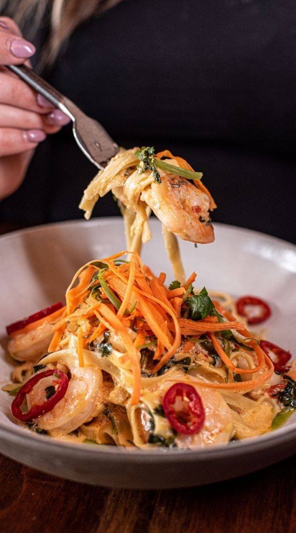 Thai Chili Prawn Pasta with Fettuccine, Jalapeños, Cilantro & Spicy Coconut Cream Sauce at Red Cork Bistro in Mukilteo Thai Chili Prawn Pasta with Fettuccine, Jalapeños, Cilantro & Spicy Coconut Cream Sauce at Red Cork Bistro in Mukilteo